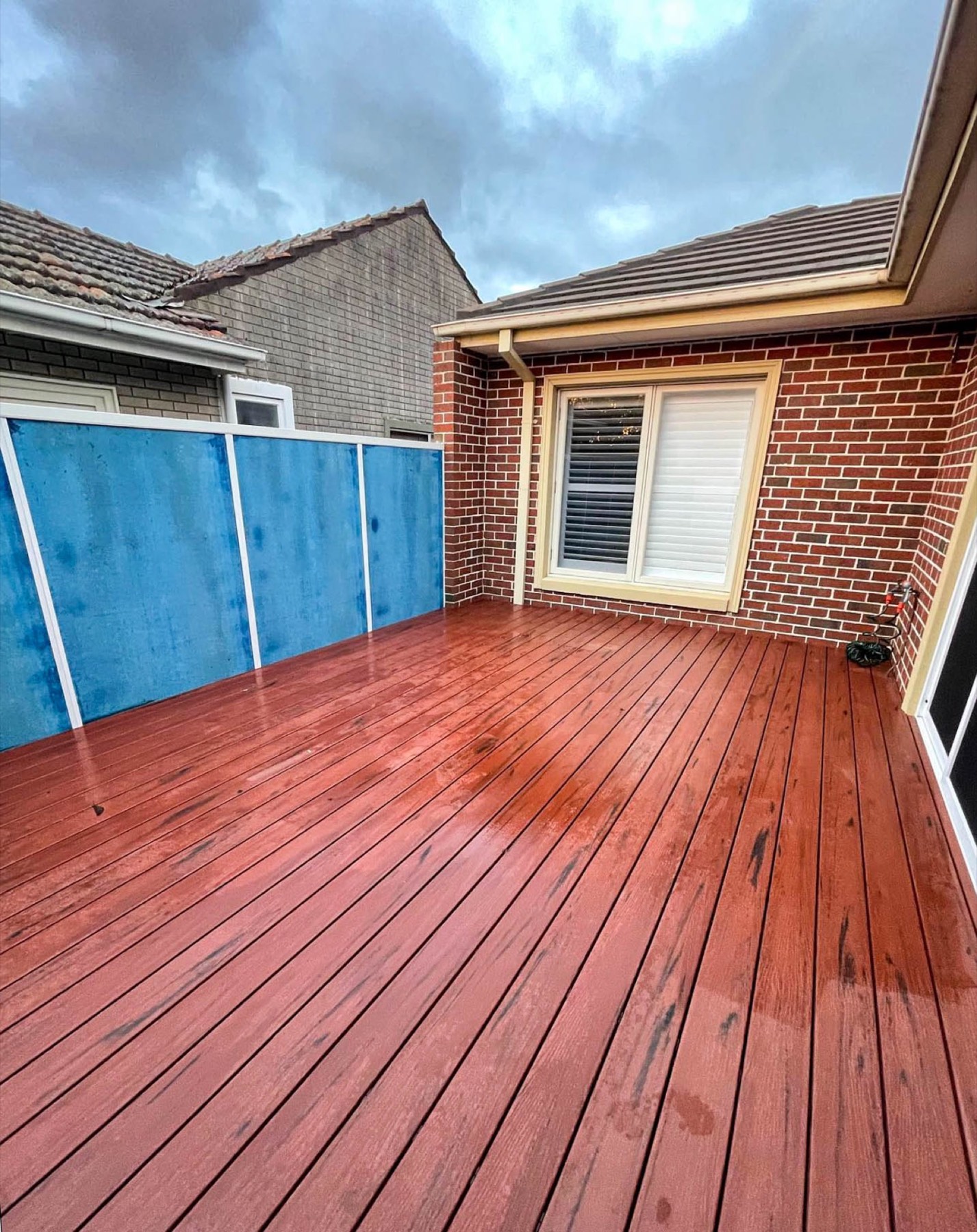 Completed composite deck extension with new Blueboard privacy fence