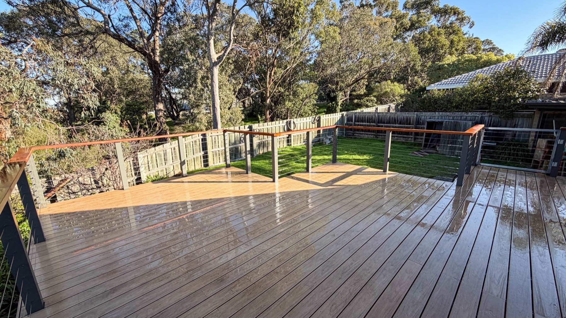 Completed composite deck with wire balustrade, Merbau handrail and safety gates