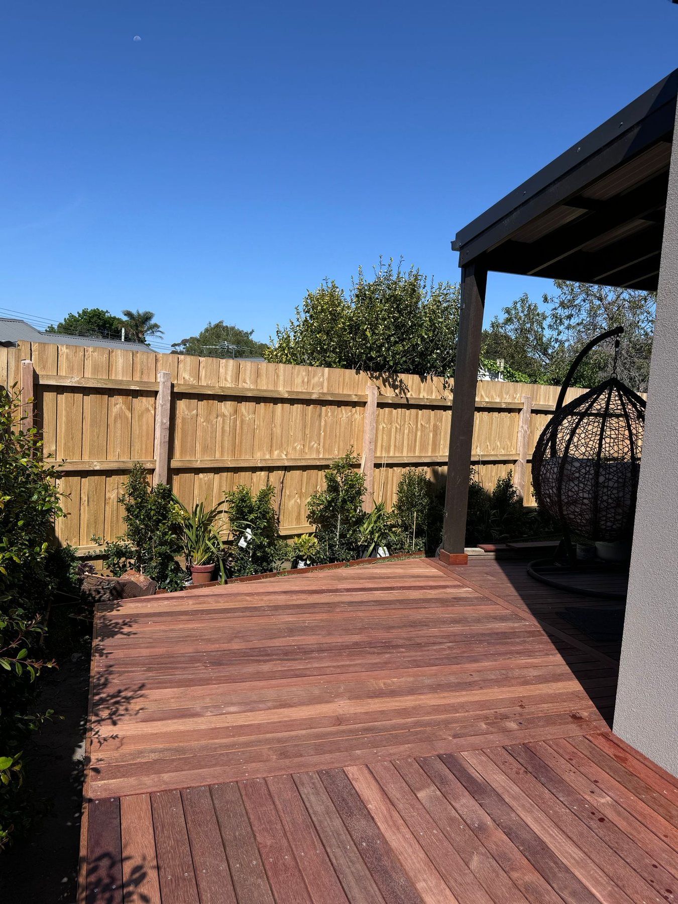 Completed deck extension connecting the outdoor areas around the home