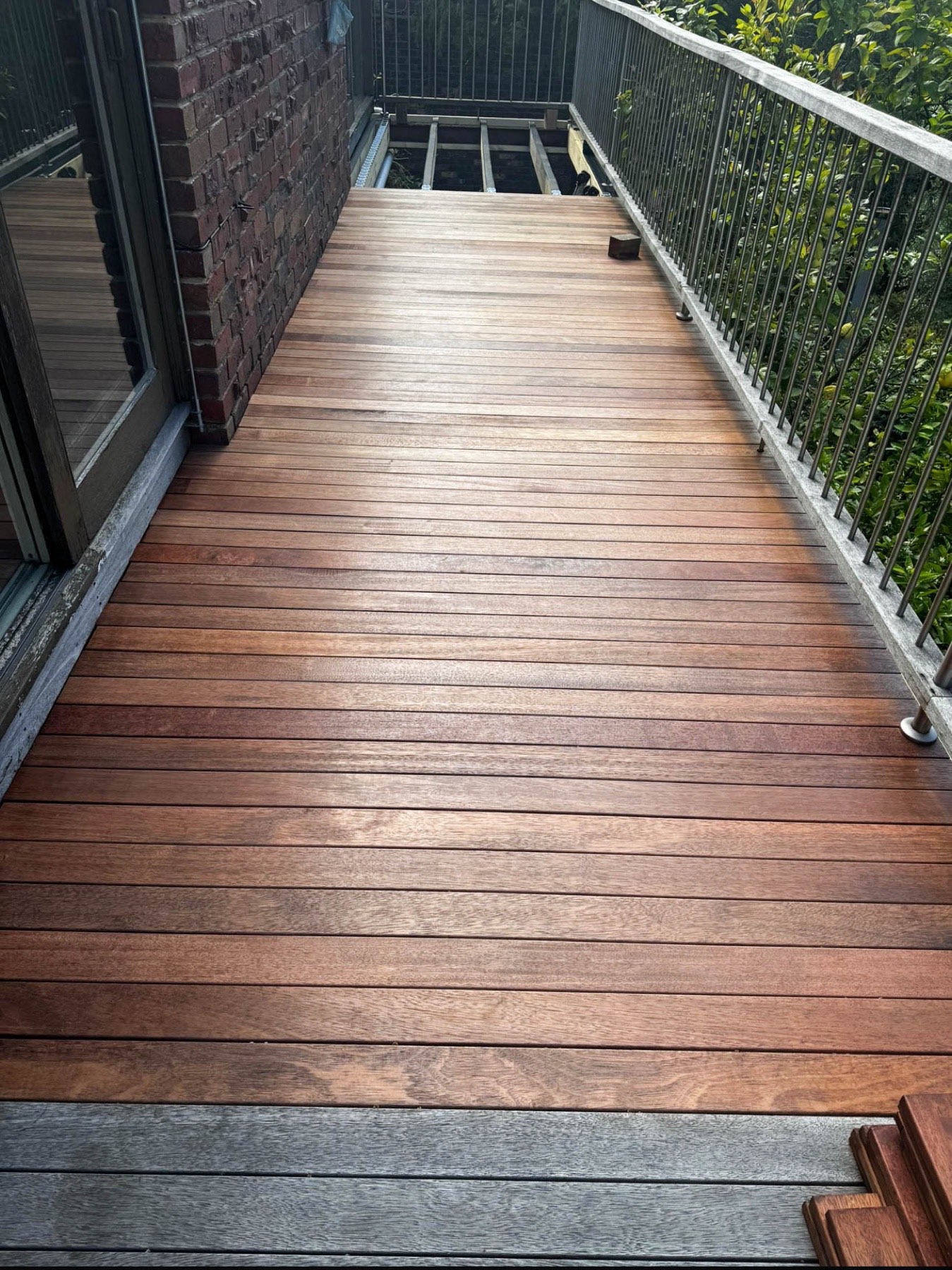 Completed Merbau balcony decking with a screw-free finish