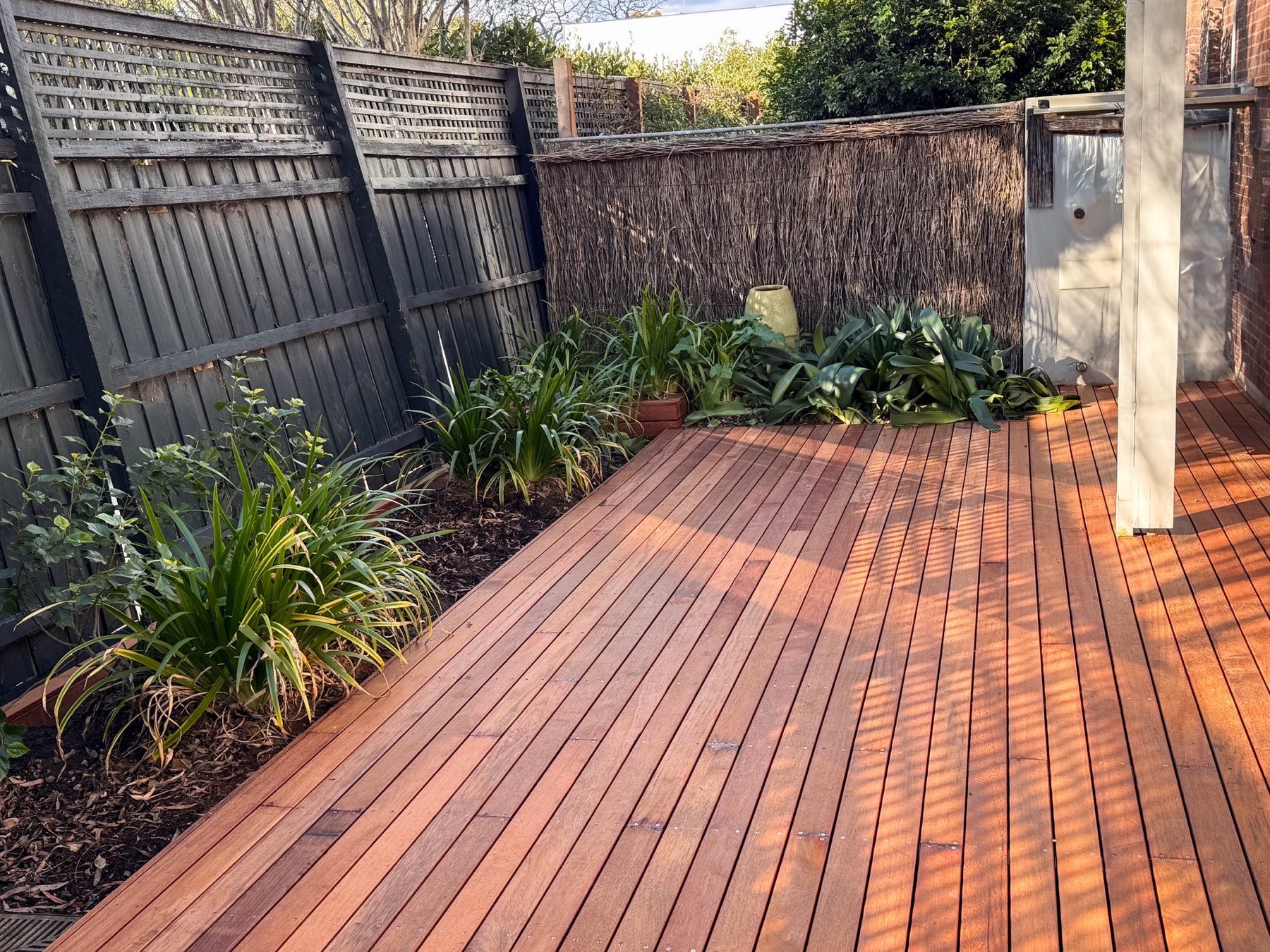Completed deck integrated with the established garden