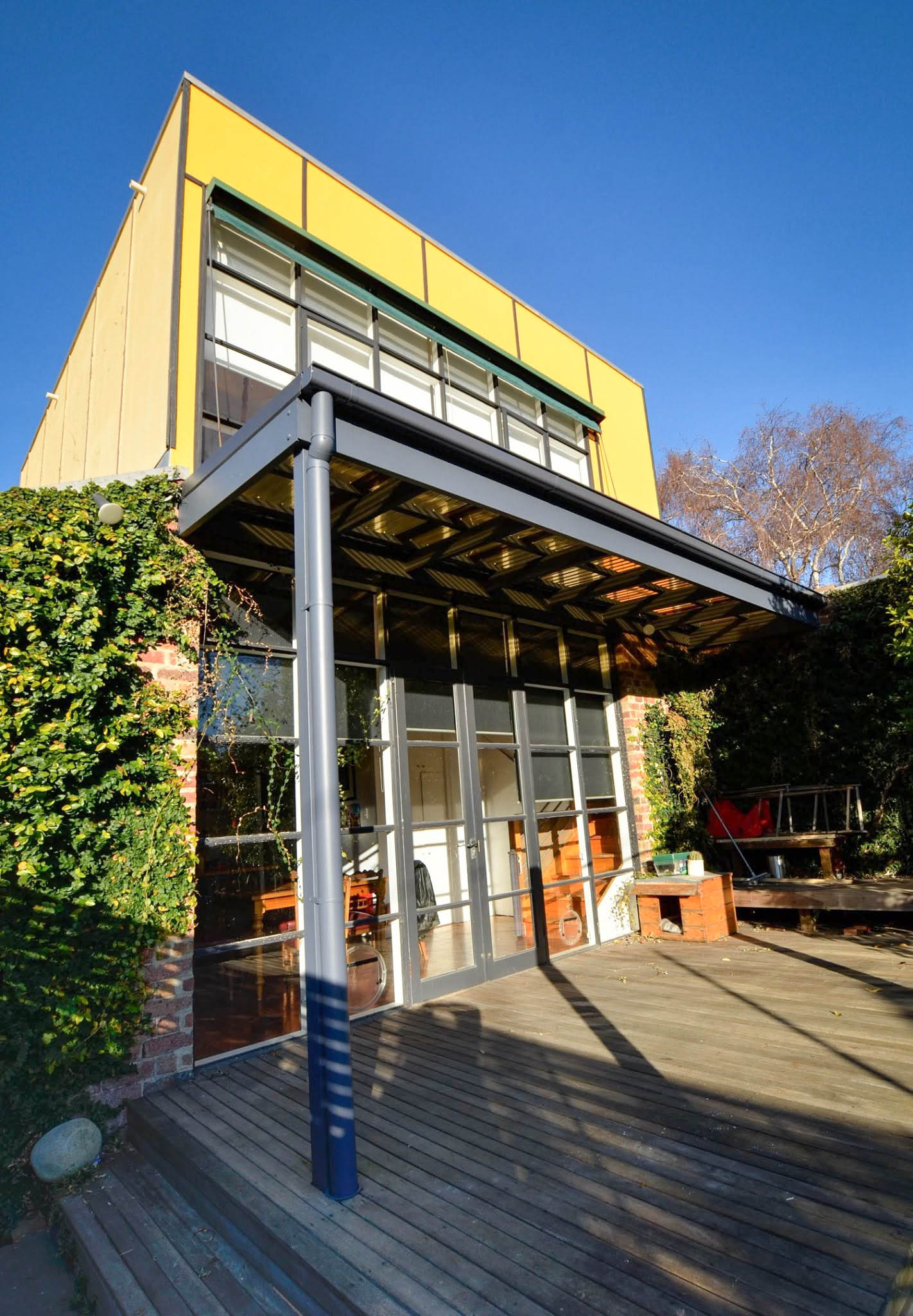 Completed St Kilda pergola, polycarbonate roof and repainted upper-storey façade