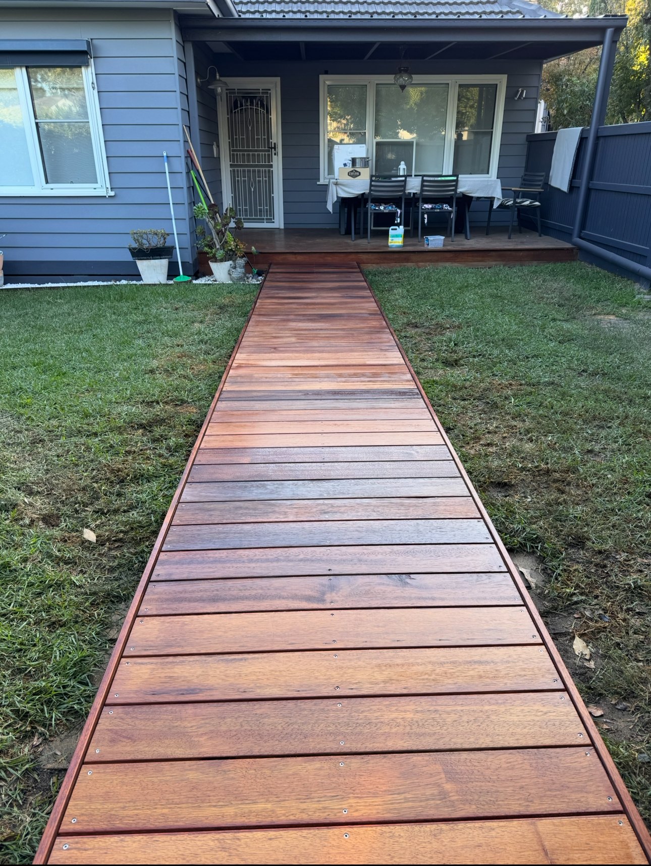 Completed timber boardwalk providing a clear route to the covered entrance