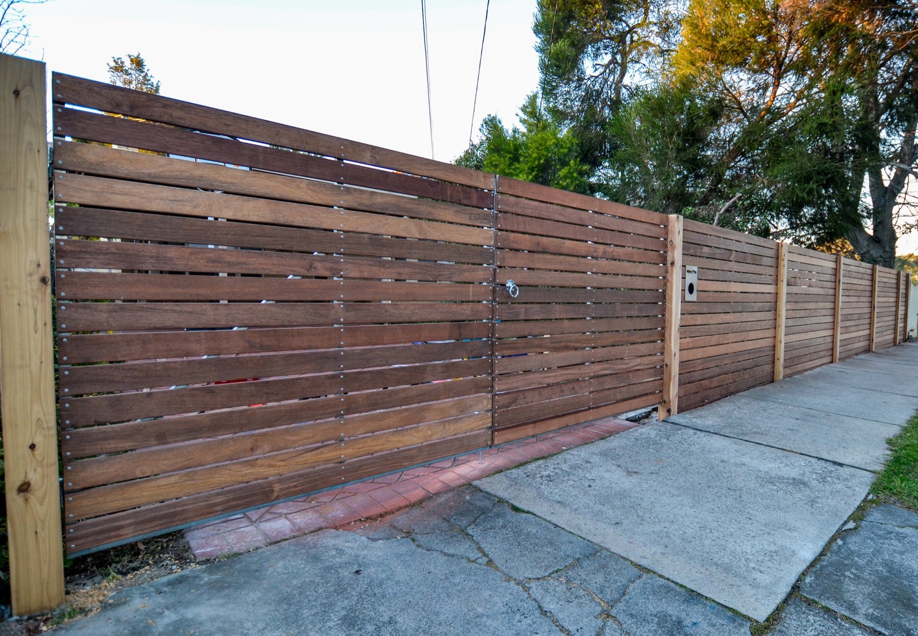 Completed Merbau driveway gates and street boundary fence — Parkdale