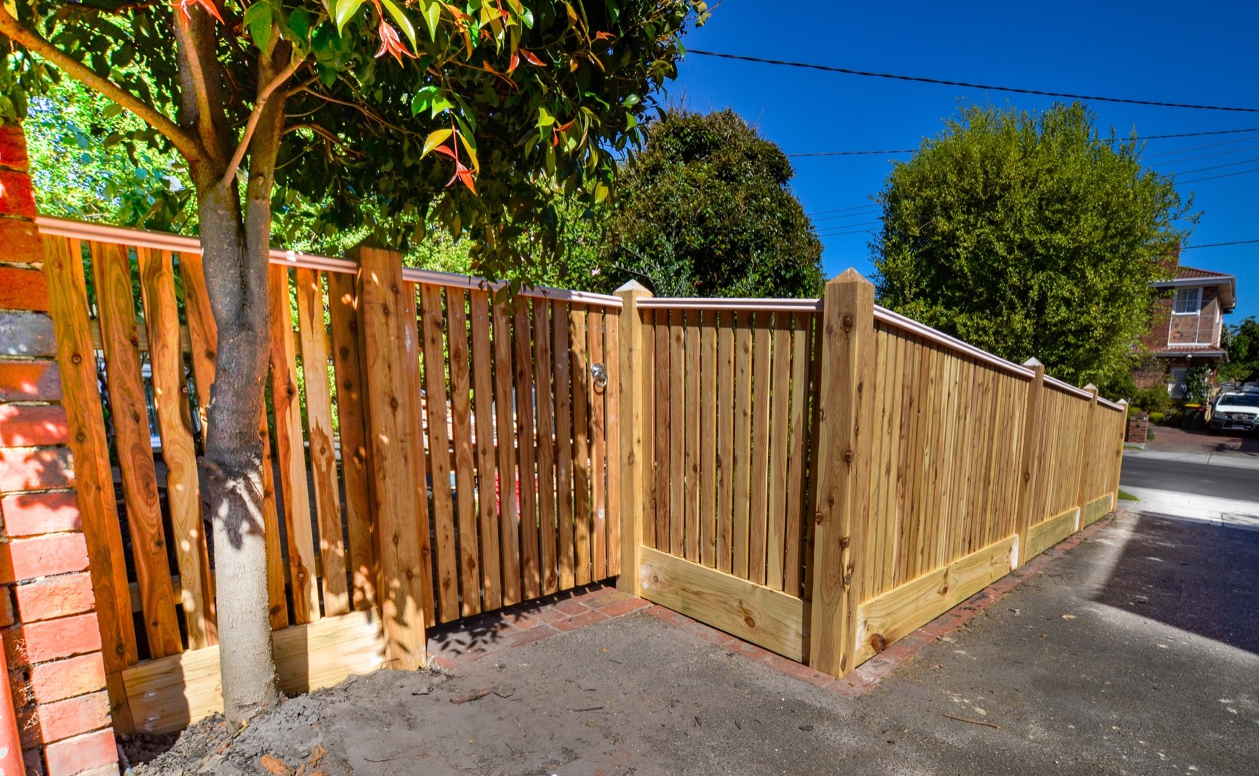 Matching timber pedestrian gate and finished boundary fence