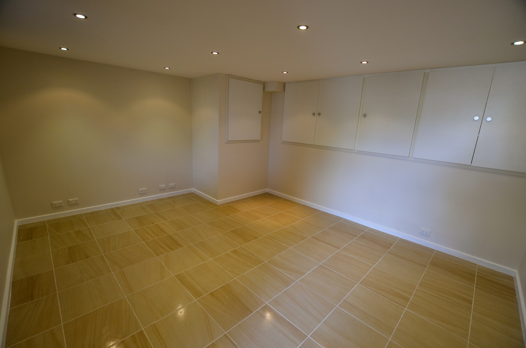 Completed room with new tiled floor, repaired walls and fresh paint