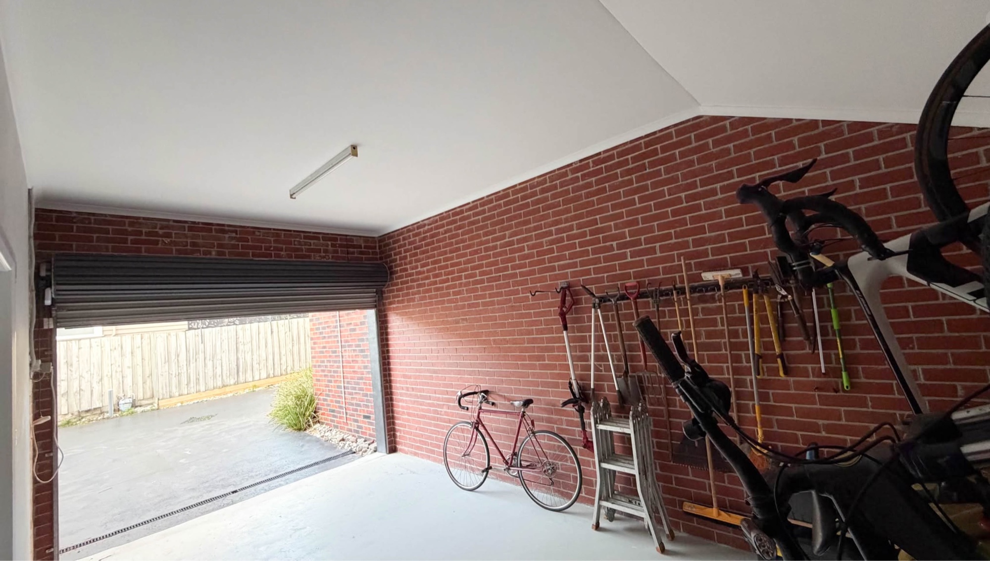 Completed garage ceiling with a bright, clean painted finish — Ormond