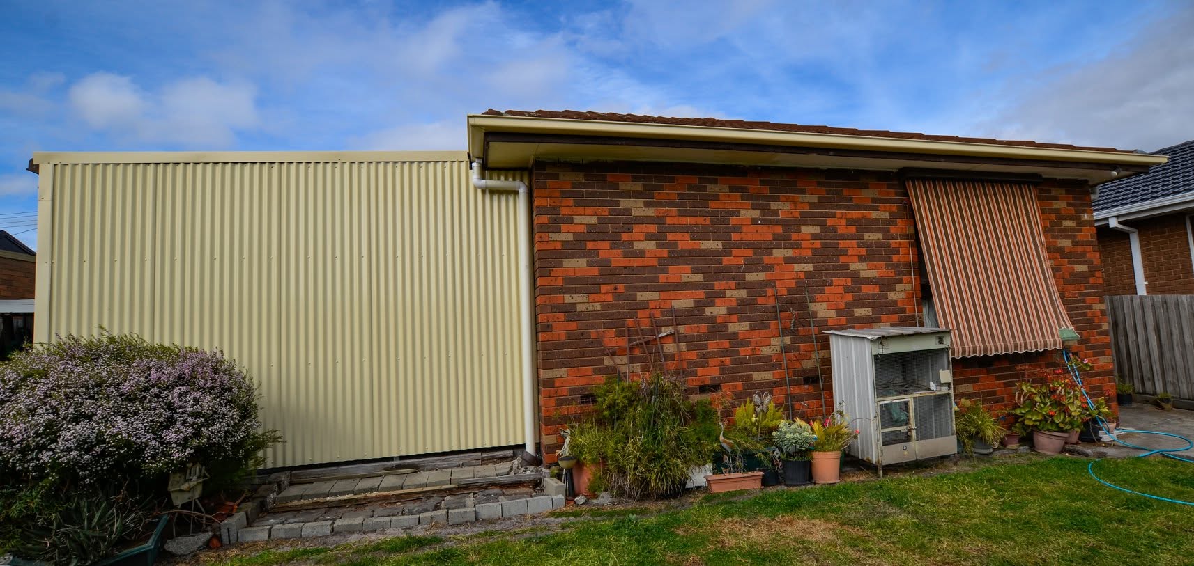 Completed Colorbond gutters, PVC downpipes and corrugated storage-room cladding