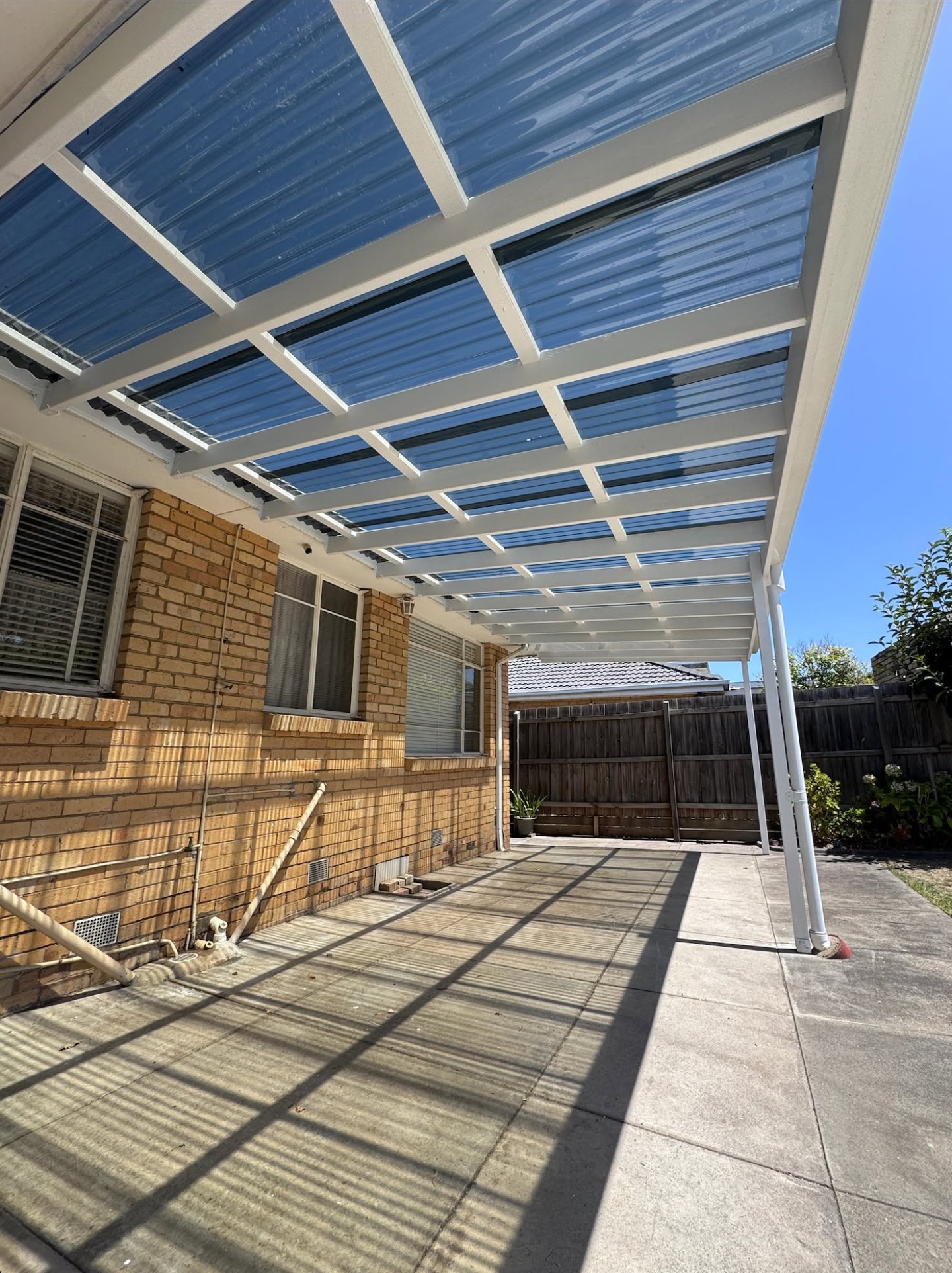 Completed pergola with new clear polycarbonate roof sheets